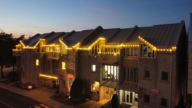 Christmas lights installation on a commercial building in Terrebonne